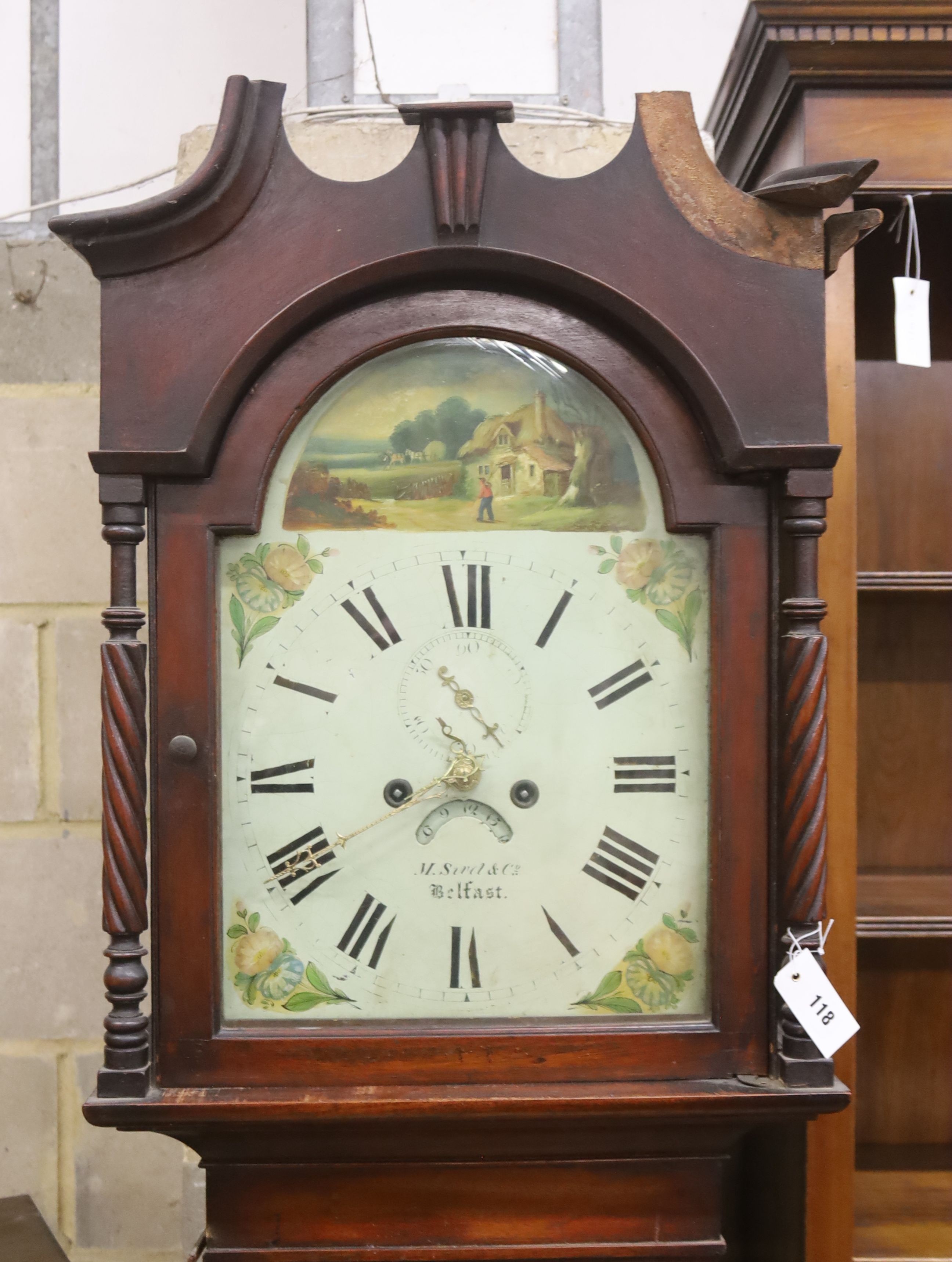 A mid 19th century mahogany eight day longcase clock, the arched painted dial marked M. Sivel & Co., Belfast, height 214cm